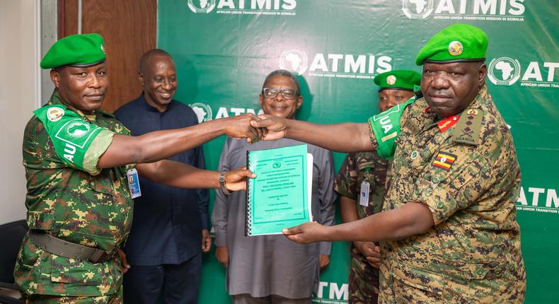 Deputy Chief of Defence Forces Lt. Gen. Sam Okiding (right) handed over to Maj. Gen Marius Ngendabanka