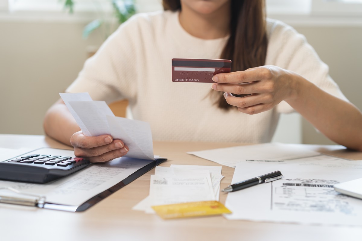 Financial,Owe,,Stressed,Asian,Woman,,Girl,Hand,Holding,Credit,Card,