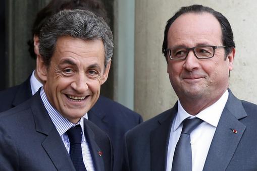 File photo of French President Hollande who stands with Sarkozy, former president and current head of the Les Republicains political party at the Elysee Palace in Paris