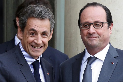 File photo of French President Hollande who stands with Sarkozy, former president and current head of the Les Republicains political party at the Elysee Palace in Paris