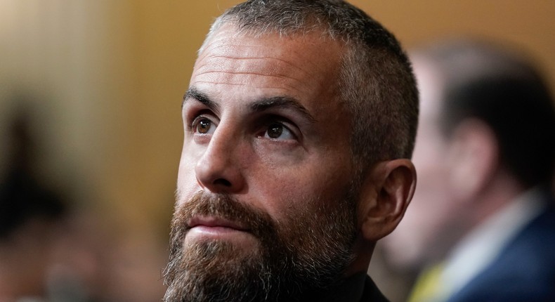 Former Washington Metropolitan Police Department officer Michael Fanone listens as the House select committee investigating the Jan. 6 attack on the U.S. Capitol holds a hearing at the Capitol in Washington, Thursday, July 21, 2022.