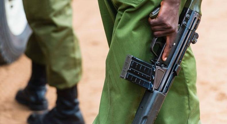 A Kenyan police officer holding a gun (Courtesy)