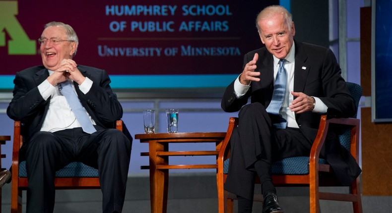 President Joe Biden, right, and former Vice President Walter Mondale share a laugh during a discussion as part of a tribute to Mondale at George Washington University's Jack Morton Auditorium, October 20 2015.
