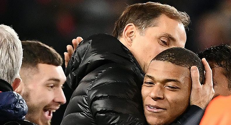 Paris Saint-Germain coach Thomas Tuchel embraces Kylian Mbappe after the French side's 2-0 win over Manchester United