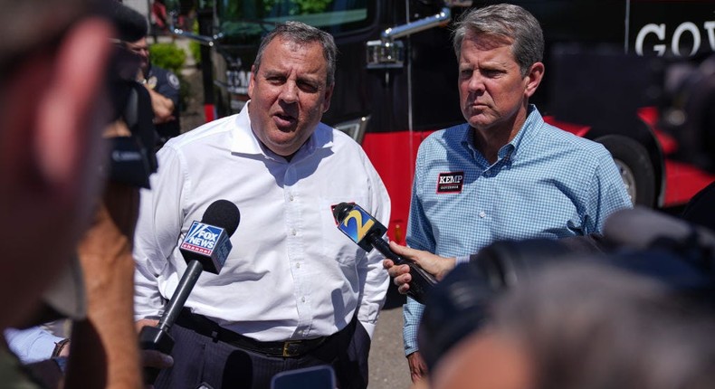 Former New Jersey Gov. Chris Christie, left, and Georgia Gov. Brian Kemp talk to the media at a campaign event in Canton, Ga., on May 17, 2022.