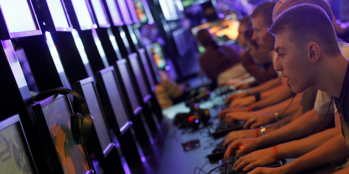 Visitors play ''World of Warcraft'' at an exhibition stand during the Gamescom 2011 fair in Cologne August 18, 2011. The Gamescom convention, Europe's largest video games trade fair, runs from August 17 to August 21.