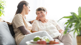 Woman talking with elderly mother