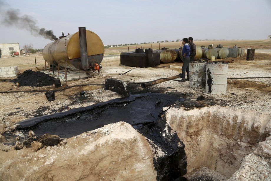 A makeshift oil-refinery site in Marchmarin town, southern countryside of Idlib, Syria, December 16, 2015.