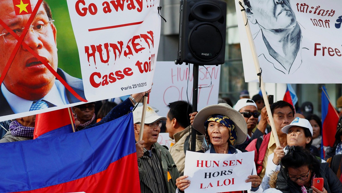 Protesters attend a protest against Cambodia's Prime Minister Hun Sen during the EU-Asia leaders sum