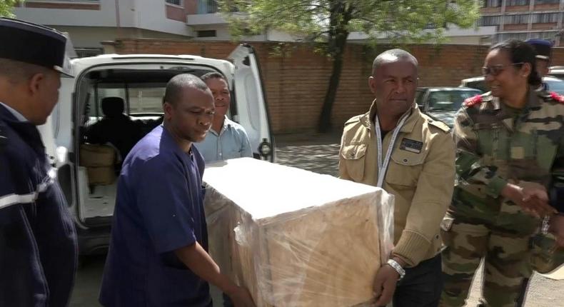 The coffin containing the remains of British Cambridge University student Alana Cutland was carried out from the morgue