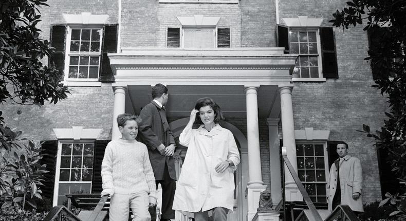 Jackie Kennedy walks down the steps from her new home in Georgetown.Bettmann/Getty Images