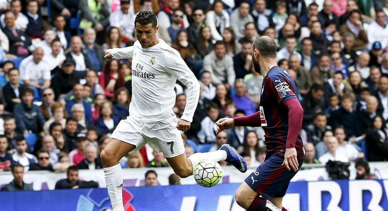 Football Soccer - Real Madrid v Eibar- Spanish Liga BBVA - Santiago Bernabeu, Madrid, Spain - 09/04/16  Real Madrid's Cristiano Ronaldo and Eibar's Ivan Ramis in action REUTERS/Andrea Comas