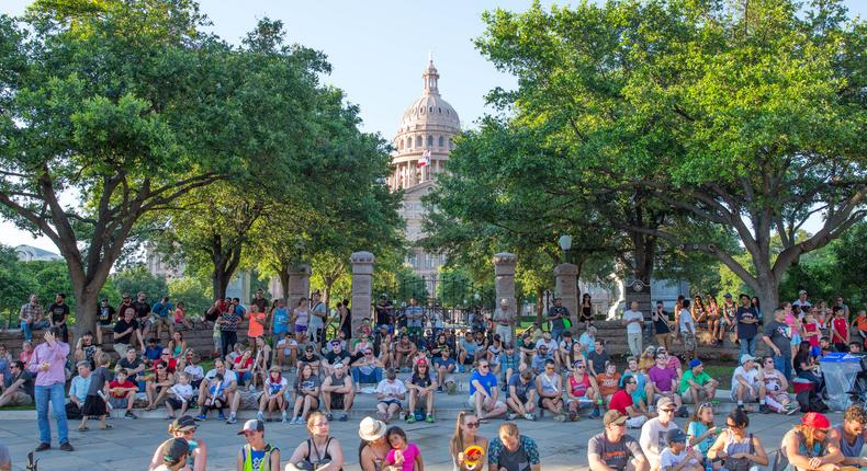 A crowd gathers outside of Austin's capitol building.Suzanne Cordeiro/Getty images