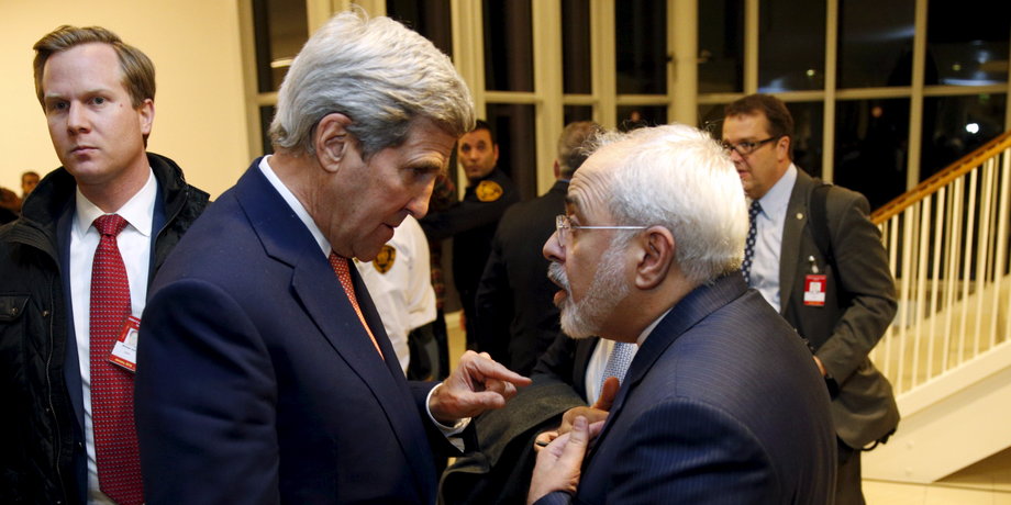 US Secretary of State John Kerry talks with Iranian Foreign Minister Javad Zarif after the International Atomic Energy Agency (IAEA) verified that Iran has met all conditions under the nuclear deal, in Vienna January 16, 2016.