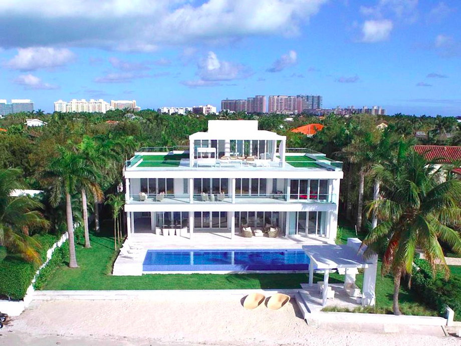 Out on Key Biscayne, this new 10,000-square-foot seven-bedroom contemporary mansion clocks in at just under $30 million. That's because it has 100 feet of private sunset-facing beach with Miami skyline views — a rare combination. "That's the dream," Alexander says.