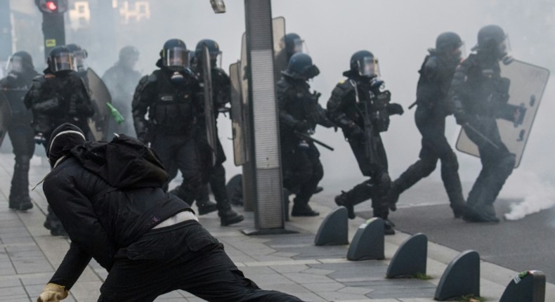 Riot police officers faced off against demonstrators during a yellow vest protest in Nantes, western France, on November 16