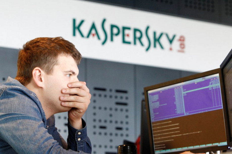 FILE PHOTO - An employee works near screens in the virus lab at the headquarters of Russian cyber security company Kaspersky Labs in Moscow