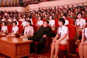 FILE PHOTO: North Korean leader Kim Jong Un and wife Ri Sol Ju enjoy an art performance given by the