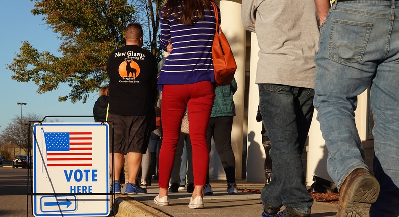 Residents wait in line to vote at a shuttered Sears store in the Janesville Mall on November 03, 2020 in Janesville, Wisconsin.Scott Olson/Getty Images