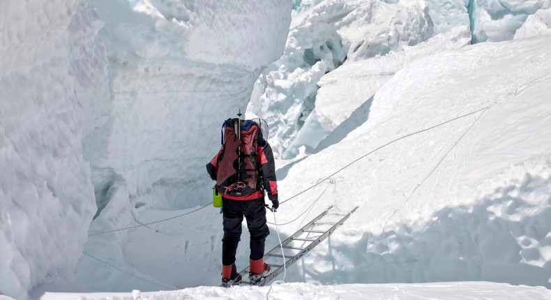 Navigating the Khumbu Icefall involves crossing ladders laid over crevasses that can be up to hundreds of feet deep.Jason Maehl/Getty Images