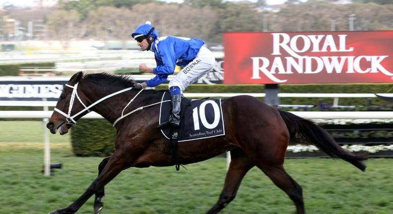 Jockey Hugh Bowman rides Winx during the Winx Stakes horse race at the Royal Randwick race course in Sydney in August last year