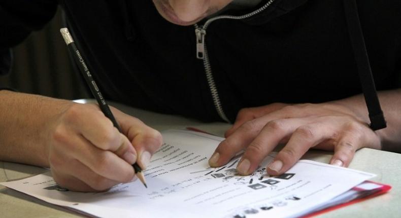 A refugee student attends a class at the Heinrich-von-Brentano School in Hochheim am Main, Germany, in a step back to a normal life