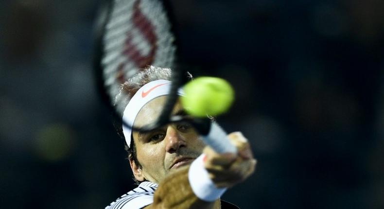 Roger Federer of Switzerland returns the ball to Russia's Evgeny Donskoy on March 1, 2017, in Dubai