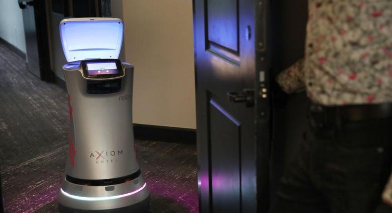 A Savioke robot delivering items to a hotel guest.
