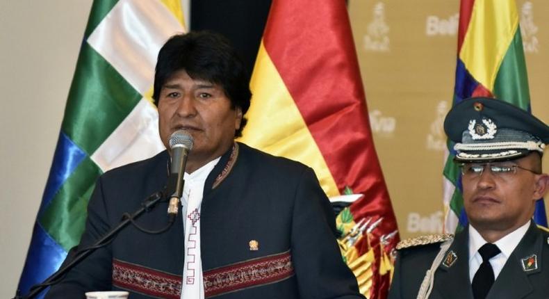 Bolivia's President Evo Morales Ayma (L), speaks during the presentation of the Rally Dakar 2018 in La Paz, on March 29, 2017