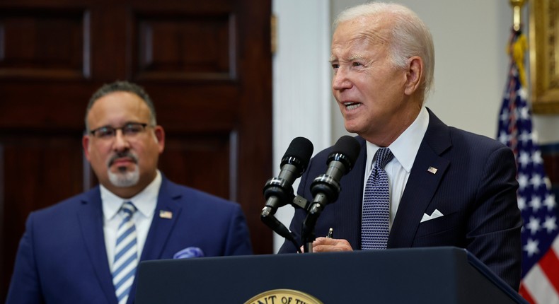 U.S. President Joe Biden is joined by Education Secretary Miguel Cardona (L).Chip Somodevilla/Getty Images