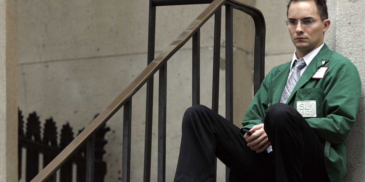 A trader sits outside the New York Stock Exchange October 6, 2008.