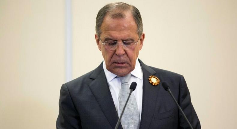 Russian Foreign Secretary Sergey Lavrov checks his smartphone during a 2015 press conference in Sochi, Russia