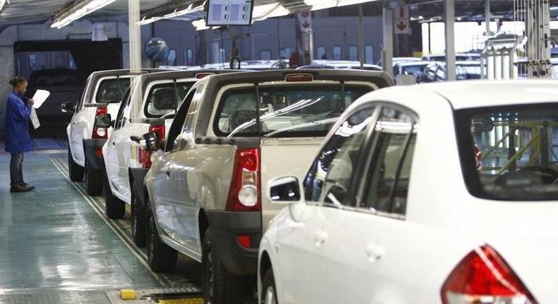 A worker inspects cars at Nissan's manufacturing plant in Rosslyn, outside Pretoria, file photo. 