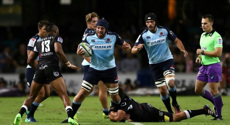 Waratahs' Dean Mumm (C), seen in action during their Super Rugby match against Sharks, at the Kings Park in Durban, on March 11, 2017