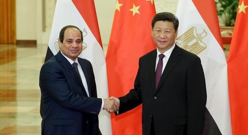 Chinese President Xi Jinping (R) shakes hands with Egyptian President Abdel Fattah Al-Sisi at The Great Hall Of The People on September 2, 2015 in Beijing. REUTERS/Lintao Zhang/Pool