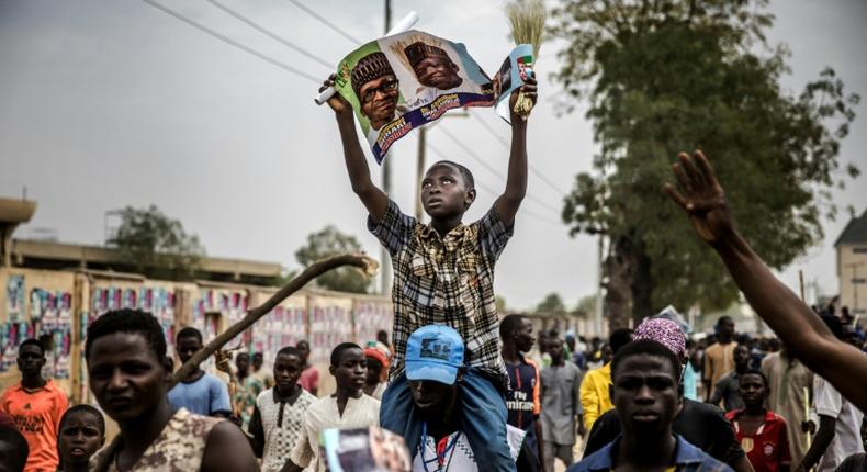 Supporters of President Muhammadu Buhari celebrated his election victory last month, but the violence that marred some polls that have had to be re-run appeared to have returned Saturday