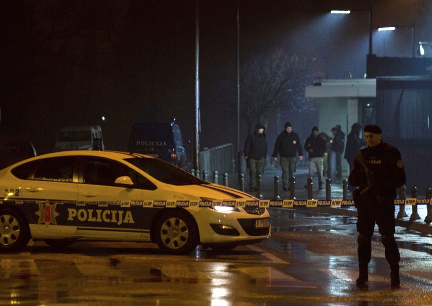 Police guard the entrance to the United States embassy building in Podgorica