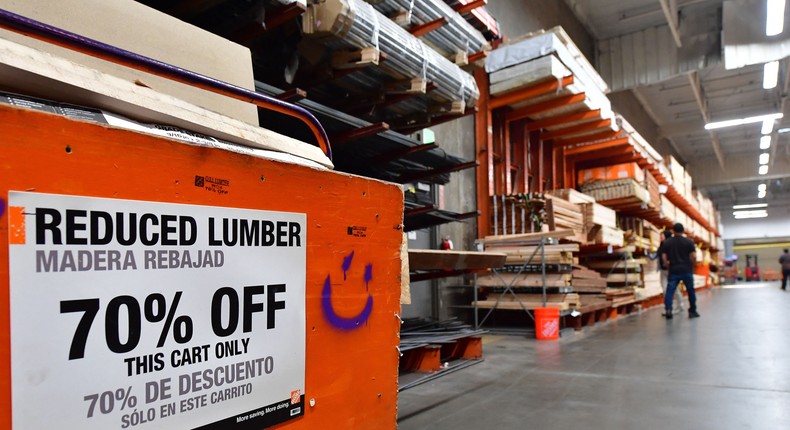 A discounted batch of planks is seen as people shop for lumber at a Home Depot store in Alhambra, California on May 4, 2022.