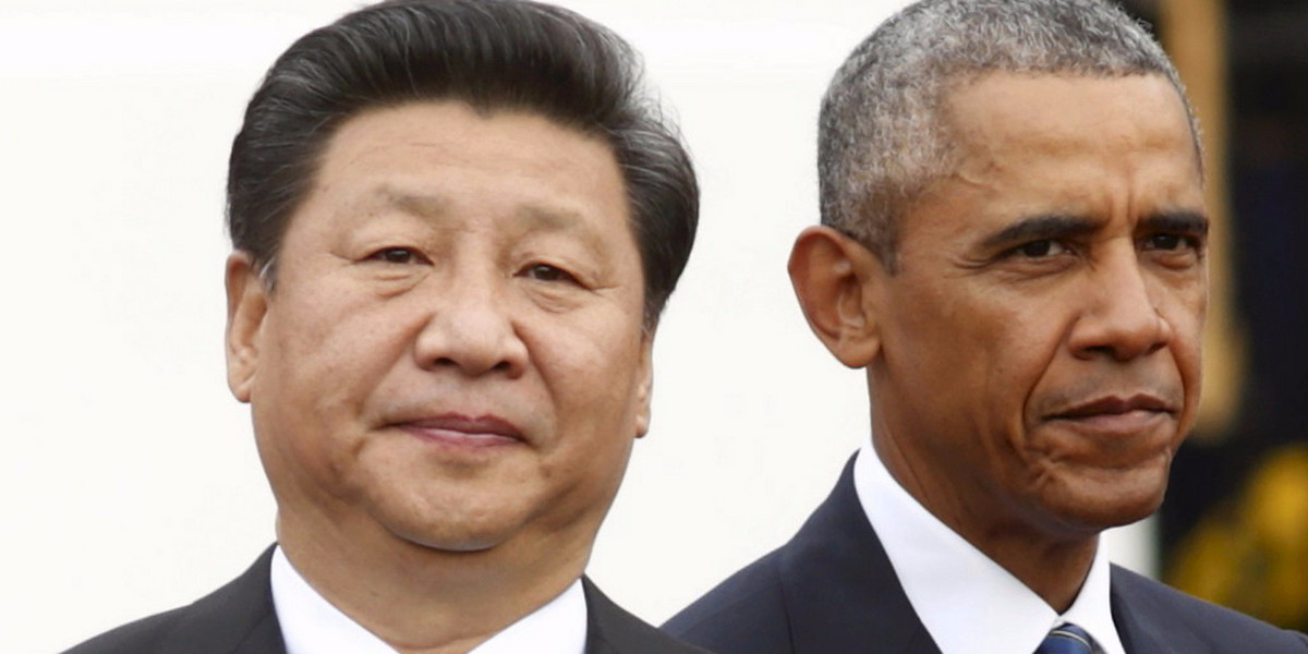 President Barack Obama stands with Chinese President Xi Jinping.