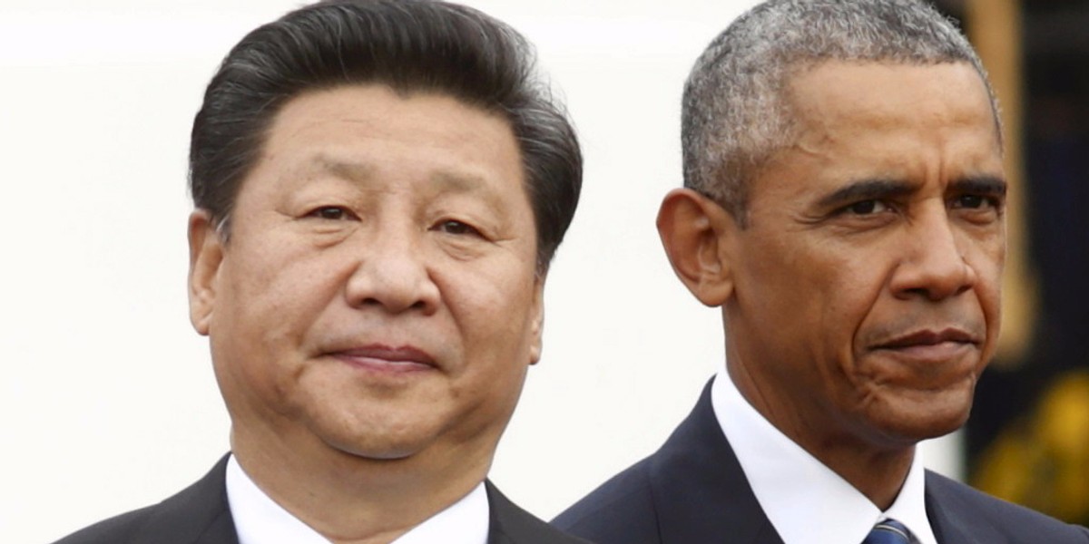 President Barack Obama stands with Chinese President Xi Jinping.