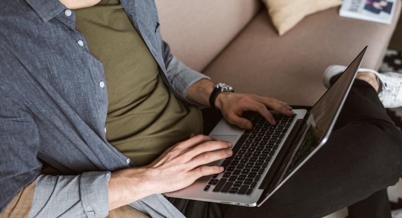 man working from home laptop