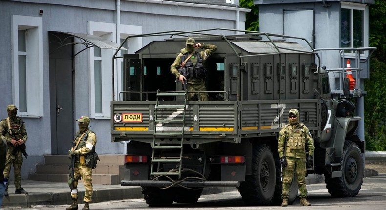 Russian soldiers guard an area as a group of foreign journalists visit in Kherson, Kherson region, south Ukraine, May 20, 2022.