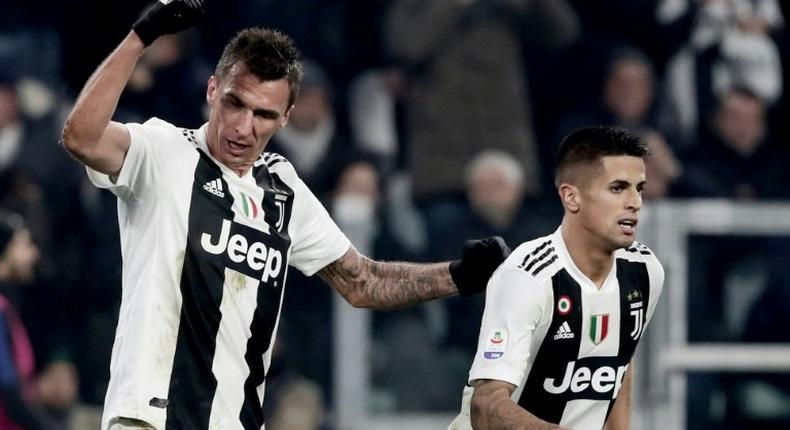 Juventus' Croatian forward Mario Mandzukic (L) scored his seventh league goal this season