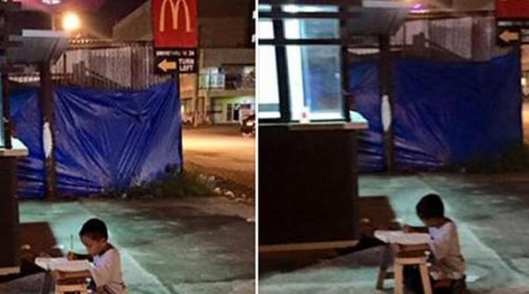 A McDonald's fényei alatt írja házi feladatát a hajléktalan kisfiú - fotó!