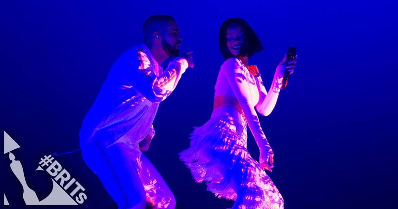 Rihanna nie sprawiła fanom zawodu i pojawiła się na Brit Awards 2016. Słynnej Barbadosce na scenie towarzyszyła Solana Rowe, znana jako SZA. Obie panie zaśpiewały otwierający nowy album Rihanny kawałek "Consideration". O wiele bardziej niegrzecznie zrobiło się później, gdy u boku Riri pojawił się Drake i wykonał swój charakterystyczny, seksowny taniec… Warto dodać, że było to pierwsze wykonanie na żywo najnowszego singla Rihanny. Zobaczcie, jak ona i raper wypadli w tym gorącym duecie i jak prezentowała się na czerwonym dywanie.