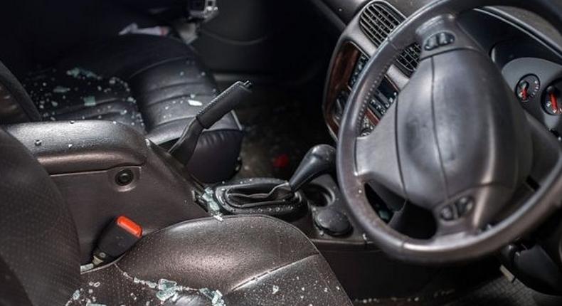 Shattered glass inside of a car after an ambush