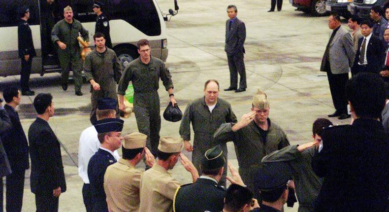 The crew of a US Navy EP-3 detained in China board a flight to Guam on April 12, 2001.US Marine Corps/Staff Sgt. John Giles