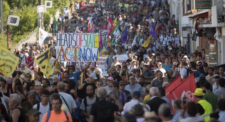 Protestors march during the annual G7 summit.