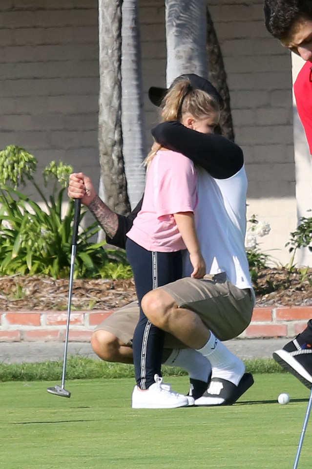 David Beckham z dziećmi na polu golfowym