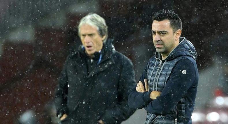 Barcelona coach Xavi (R) and Benfica boss Jorge Jesus (L) Creator: LLUIS GENE